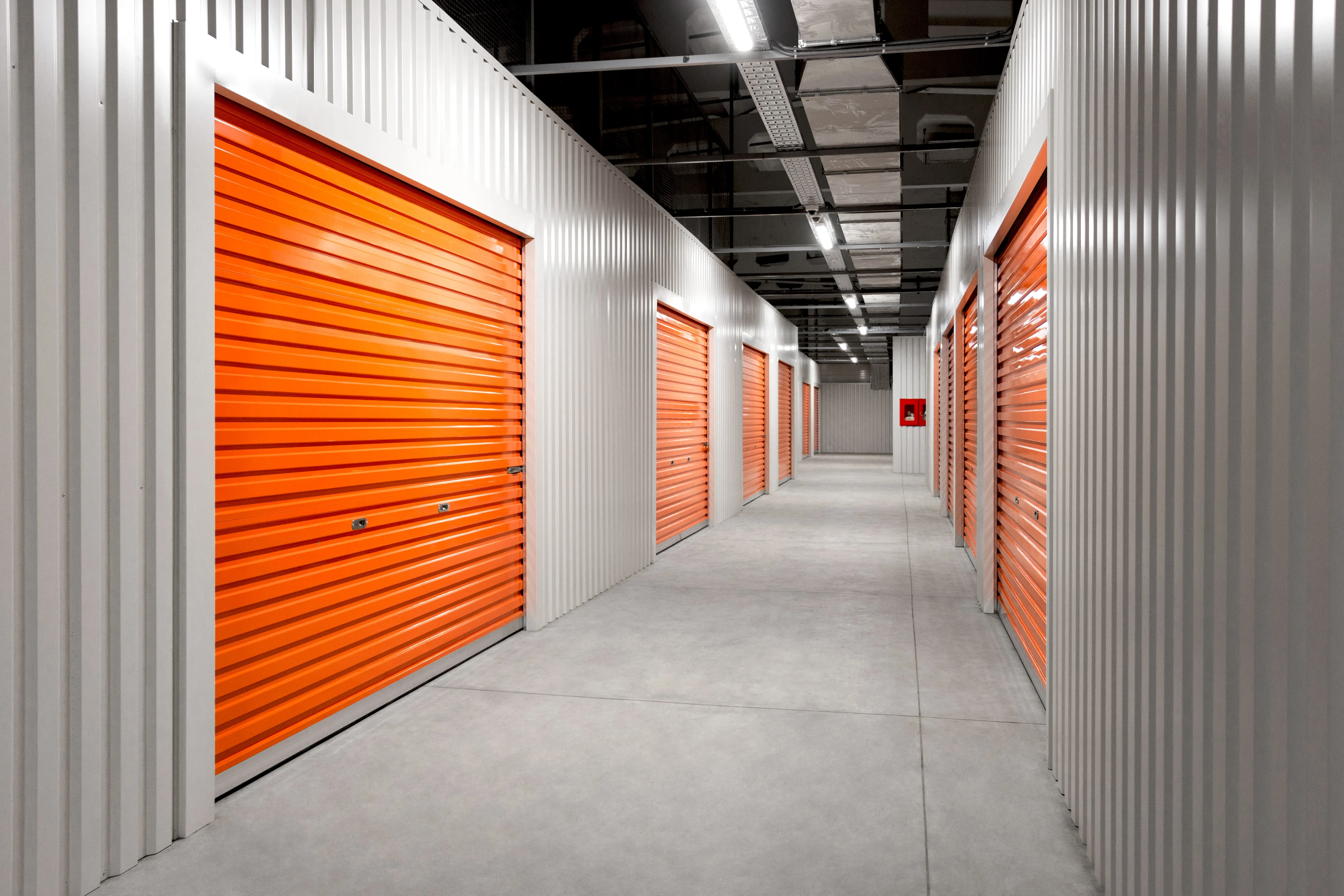 A storage corridor with roll-up doors