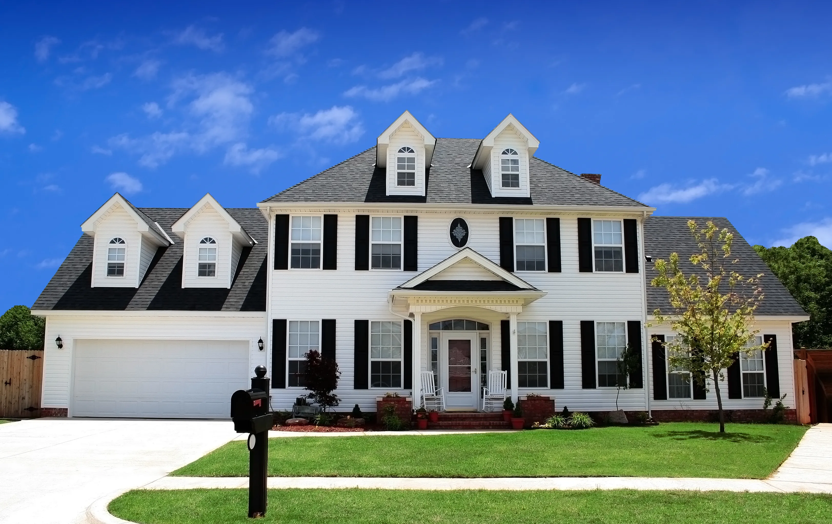 A house with a paver driveway on moving day